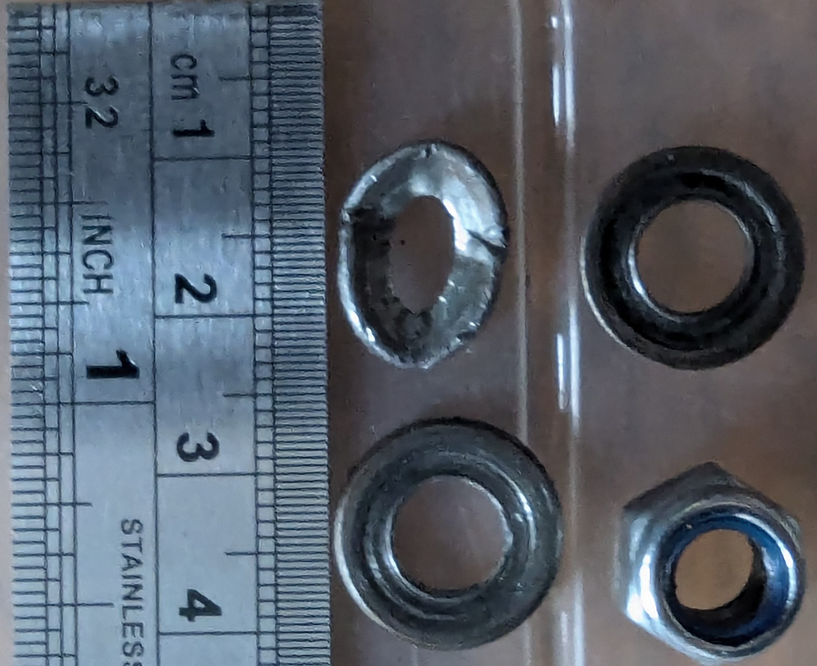 damaged washer compared to rocker m7 washers.jpg