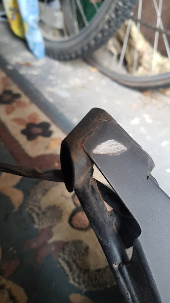 fracture at top and hitting disk brake bolts